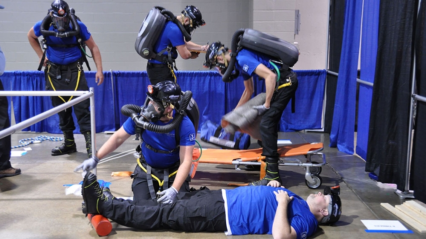 A team in the process of saving an injured miner.