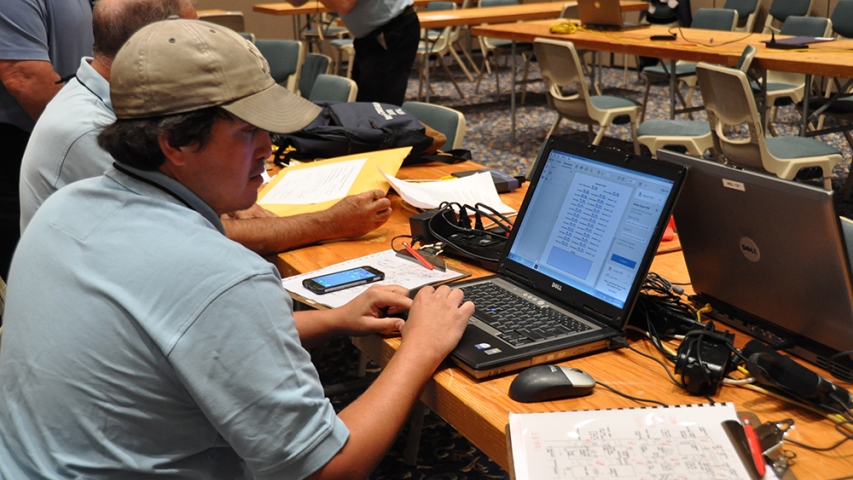 Judges tabulating a mine rescue team’s scores.