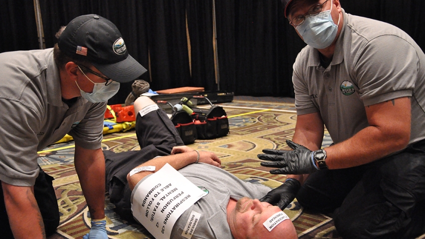 During the First Aid portion of the competition, a team triages a patient to prepare the miner for transport out of the mine.
